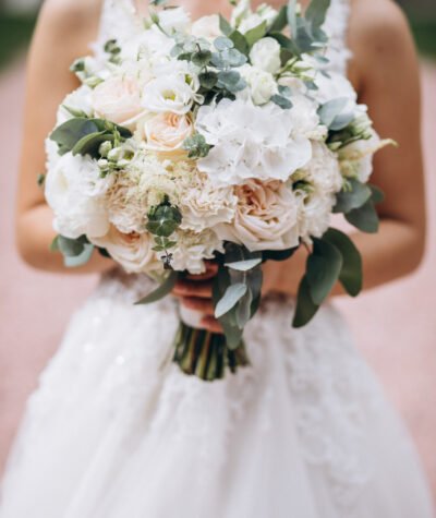 Bride holding her bouquet on her wedding day Bride holding her bouquet on her wedding day